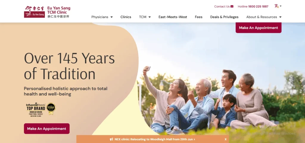 Screenshot of the Eu Yan Sang TCM Clinic website homepage. The top navigation menu includes links for Physicians, Clinics, TCM, Fees, and an "Make An Appointment" button. The main banner reads "Over 145 Years of Tradition" and "Personalised holistic approach to total health and well-being," showcasing an Influential Brands Top Brand 2025/2026 award badge. On the right, a multi-generational family of five is smiling and sitting outdoors on the grass while taking a group photo on a smartphone. A notification bar at the bottom announces a clinic relocation to Woodleigh Mall.