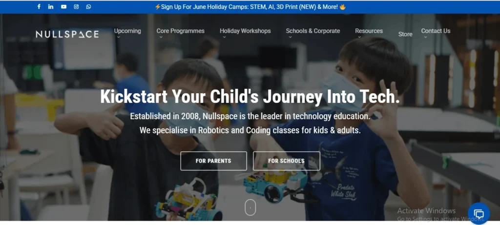 Nullspace robotics and coding classes homepage banner showing students holding tech projects with links for parents and schools.