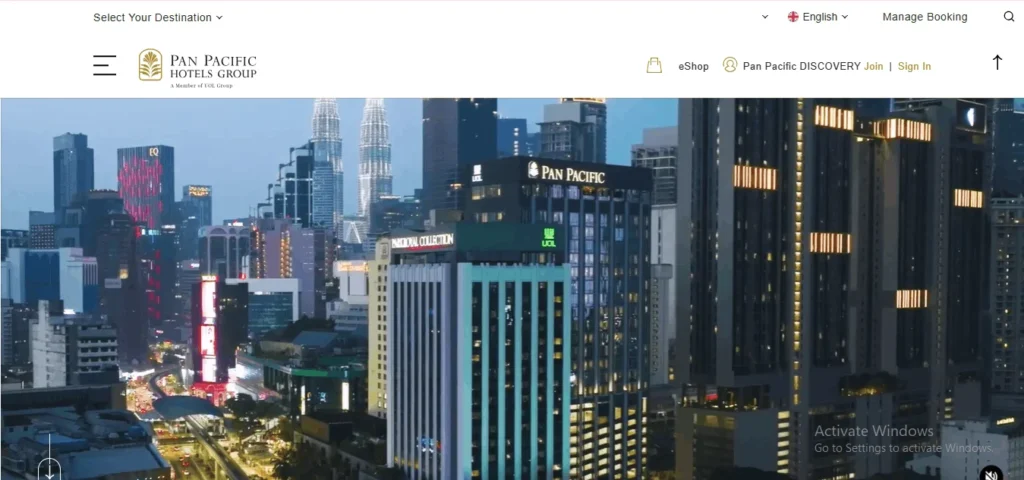 Pan Pacific Hotels Group website homepage featuring a modern city skyline at dusk with the Pan Pacific hotel building illuminated.