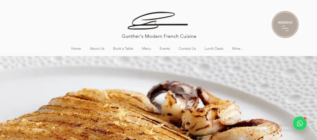A screenshot of the homepage header for Gunther's Modern French Cuisine website, featuring a navigation menu and a close-up banner image of a finely prepared, seasoned seafood dish.