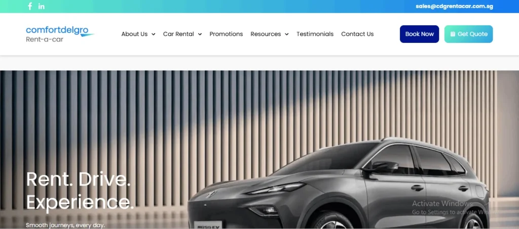 Website homepage for ComfortDelGro Rent-a-car featuring the tagline "Rent. Drive. Experience. Smooth journeys, every day." written over a banner image of a modern grey electric SUV parked against a slatted wall architecture background. The top menu bar shows the company logo, navigation links for About Us, Car Rental, Promotions, Resources, Testimonials, and Contact Us, along with a dark blue "Book Now" button and a light blue "Get Quote" button. The top banner includes social media icons and the contact email address sales@cdgrentacar.com.sg.