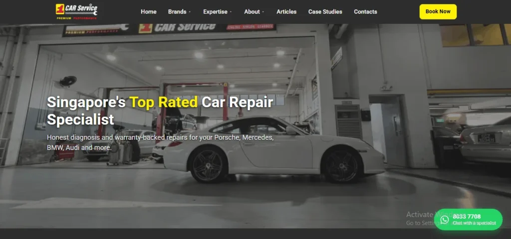 Website homepage for 1 Car Service featuring the headline "Singapore's Top Rated Car Repair Specialist" with a subheadline reading "Honest diagnosis and warranty-backed repairs for your Porsche, Mercedes, BMW, Audi and more." The background image shows a modern, bright auto workshop with a white Porsche sports car parked in the center service bay. The top navigation bar includes links for Home, Brands, Expertise, About, Articles, Case Studies, Contacts, and a yellow "Book Now" button. A green WhatsApp chat widget is visible at the bottom right.