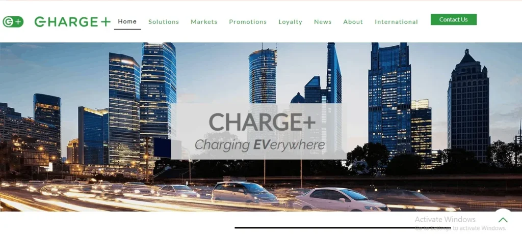 "Charge+ website homepage banner showing a city skyline at dusk with traffic light trails and the tagline 'CHARGE+ Charging EVerywhere'."