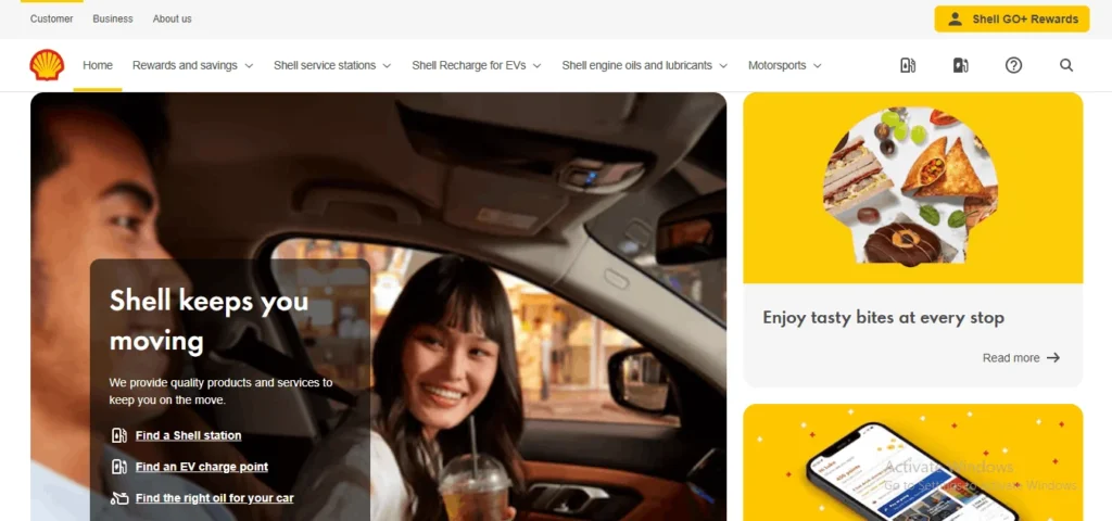 "Shell Singapore website homepage displaying a man driving with a smiling woman in the passenger seat next to text reading 'Shell keeps you moving' and a side promo for food."