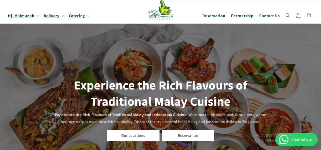 A website homepage screenshot for Hjh Maimunah Restaurant featuring a banner image filled with various traditional Malay and Indonesian dishes, including grilled fish, chicken, curry, and colorful kueh desserts. White text overlaid in the center reads "Experience the Rich Flavours of Traditional Malay Cuisine." The top header displays the restaurant's green logo alongside navigation links like "Hj. Maimunah," "Delivery," "Catering," and "Reservation." Two white call-to-action buttons, "Our Locations" and "Reservation," sit near the bottom center.