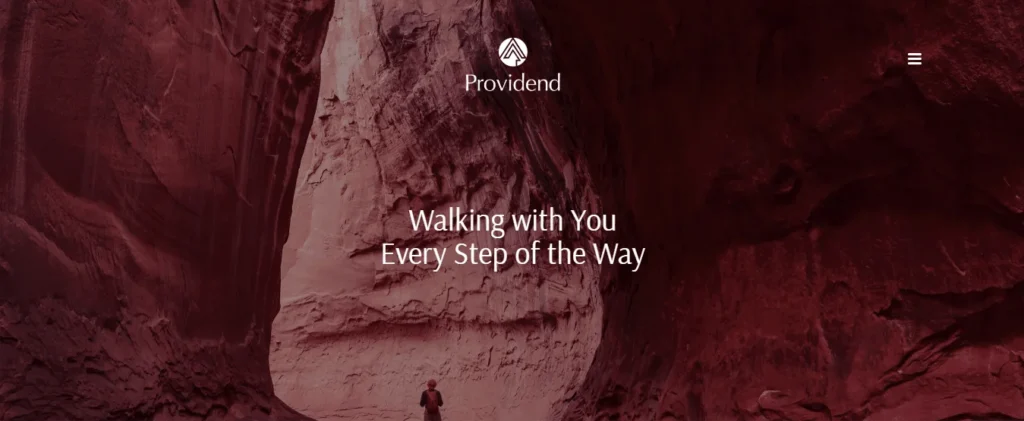 Website hero section for Providend, a financial advisory firm in Singapore, featuring a red-toned background of a traveler walking through a massive rock canyon with the text "Walking with You Every Step of the Way."