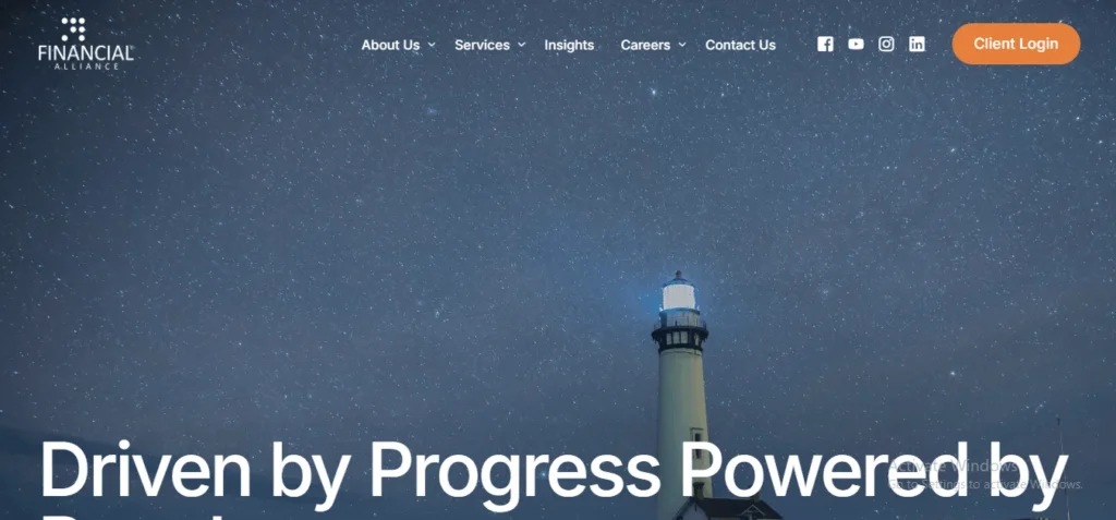 Website hero section for Financial Alliance in Singapore, featuring a lighthouse under a starry night sky with the overlay text "Driven by Progress Powered by..."