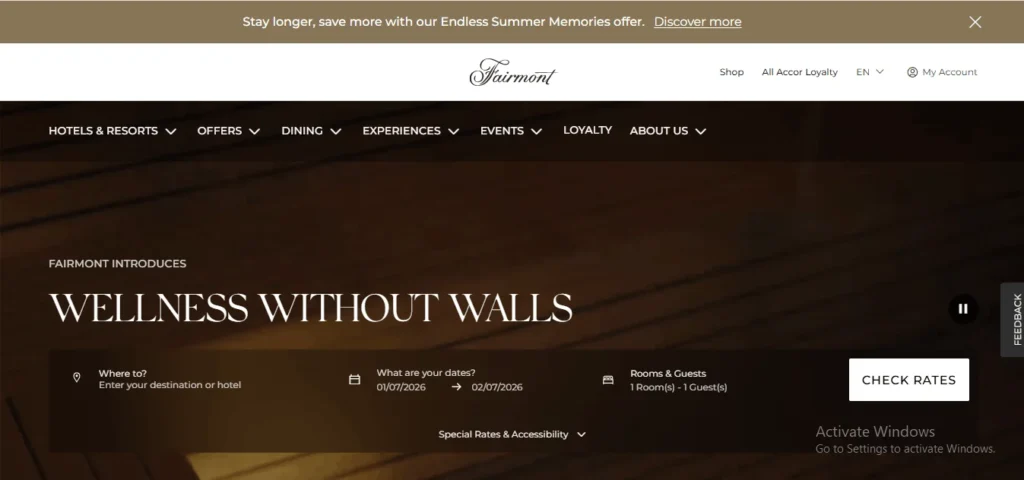 Fairmont Hotels website homepage featuring a booking bar and a promotional banner for "Wellness Without Walls."