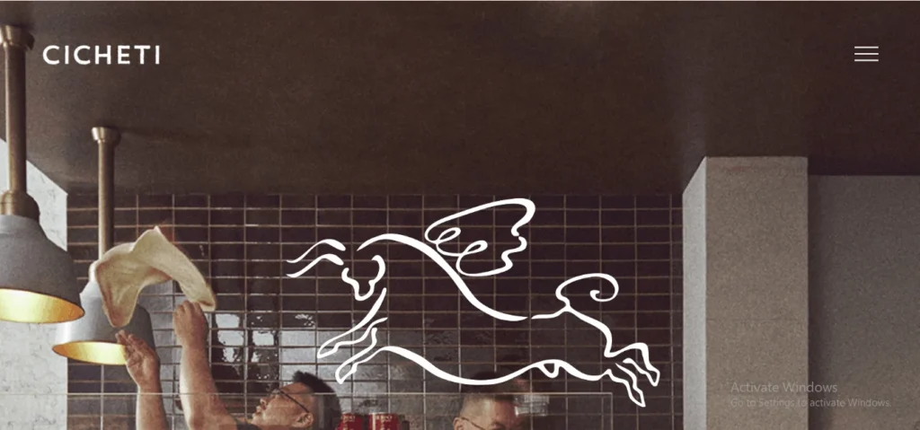 Website homepage of Cicheti restaurant in Singapore featuring a white line art logo of a winged bull overlaid on a background of a chef stretching pizza dough.