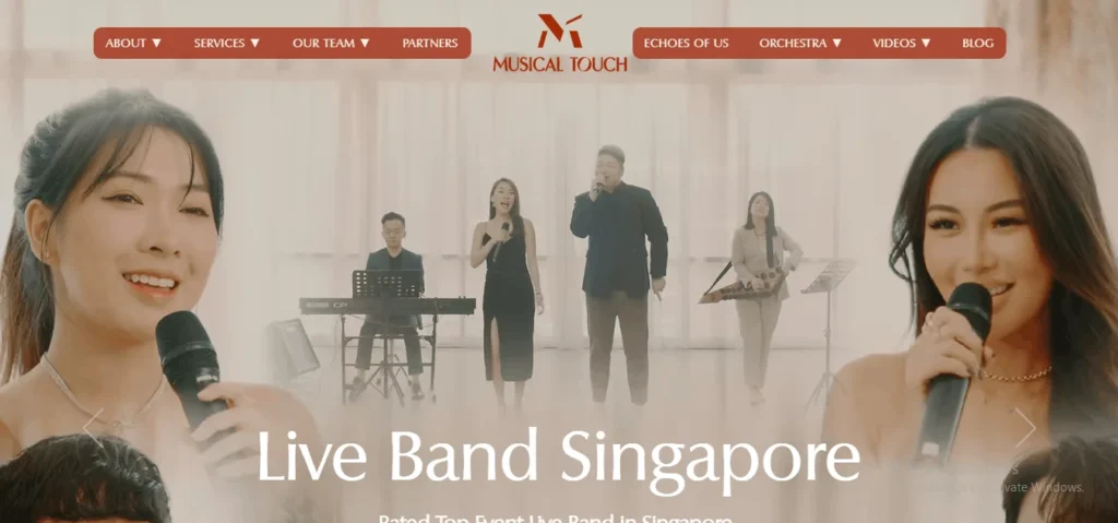 A website header for "Musical Touch" featuring a live band in Singapore. In the foreground, two female vocalists holding microphones frame the image. In the background, four band members—a keyboardist, a female singer in a black dress, a male singer in a dark suit, and a Guzheng player—perform on a bright, warmly-lit stage with the overlay text "Live Band Singapore."