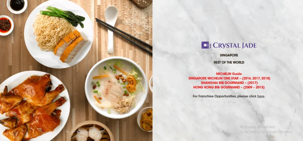 A split-screen promotional image for Crystal Jade. The left side features a top-down view of Chinese dishes like roasted meat noodles, roasted chicken, and congee on a wooden table. The right side shows the Crystal Jade logo on a white marble background, listing their Michelin Guide accolades in Singapore, Shanghai, and Hong Kong.