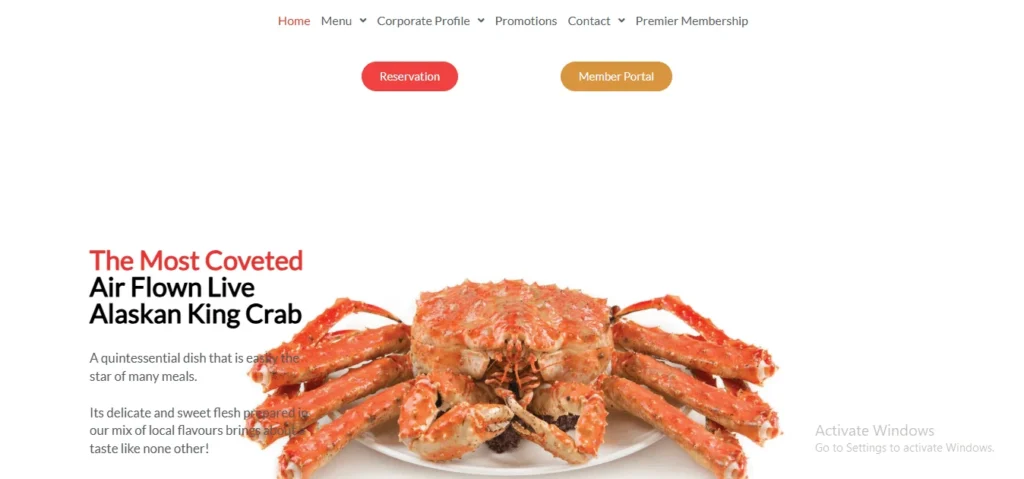 A website homepage screenshot featuring a cooked, bright orange Alaskan King Crab served on a white plate against a clean white background. To the left, text reads "The Most Coveted Air Flown Live Alaskan King Crab," followed by a short description. The top of the page displays a navigation menu with links like "Home," "Menu," and "Promotions," alongside two prominent buttons: a red "Reservation" button and a gold "Member Portal" button.
