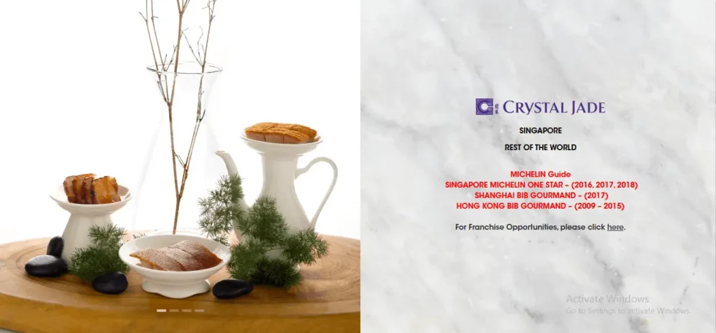 Promotional graphic for Crystal Jade restaurant, split into two sides: the left shows an elegant arrangement of roasted meat dishes on a wooden table, and the right lists their Michelin Guide accolades over a marble background.