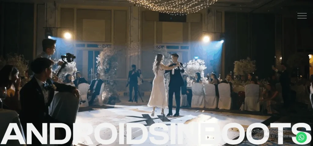 Website banner screenshot for Androidsinboots featuring a bride and groom having their first dance at a luxury Singapore indoor wedding reception.